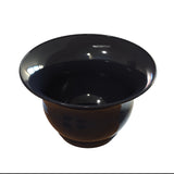 A glossy, black tulip salad bowl with a wide rim and deep, round base is shown on a white background. The bowl’s surface reflects light, highlighting its smooth and polished texture. It is also dishwasher safe for easy cleaning.