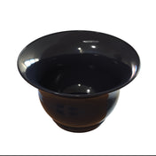A glossy, black tulip salad bowl with a wide rim and deep, round base is shown on a white background. The bowl’s surface reflects light, highlighting its smooth and polished texture. It is also dishwasher safe for easy cleaning.