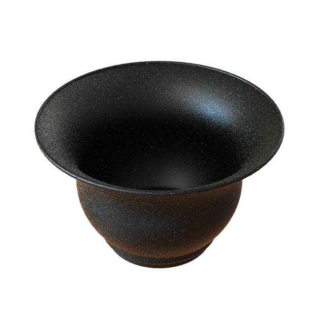 A wide, black Tulip Salad Bowl with a flared rim and speckled texture. Its matte surface features white and green flecks for a starry look. The cast aluminum salad bowl has a round shape, narrow base, and open, curved sides.