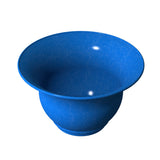 A wide, round, blue Tulip Salad Bowl with a flared rim and smooth, speckled surface is viewed from above at an angle. Two small light reflections are visible on the interior surface. The background is plain white.
