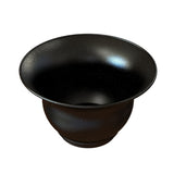 A black ceramic bowl with a wide rim, featuring a glossy finish and scattered white speckles, evokes the elegant style of a Tulip Salad Bowl. Its curved shape and depth are perfect for cold holding, set against a crisp white background.