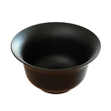 A matte black, wide-brimmed salad bowl with a smooth, slightly speckled finish. Crafted from cast aluminum, it features a flared rim and deep interior—ideal for cold holding—standing alone on a plain white background.