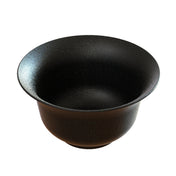 A matte black, wide-brimmed salad bowl with a smooth, slightly speckled finish. Crafted from cast aluminum, it features a flared rim and deep interior—ideal for cold holding—standing alone on a plain white background.