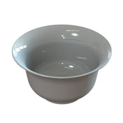 A plain, round, white salad bowl with a smooth, glossy finish. The bowl has a wide rim and deep interior, and the lighting creates shiny reflections on its surface. Its simple design is highlighted against the plain white background.