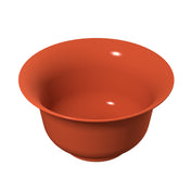 A simple, empty, round orange salad bowl with a smooth surface and a wide rim, viewed from a slightly elevated angle on a plain white background. The bowl’s glossy finish and cast aluminum material create small reflections of light inside and on the outer edge.