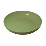 A plain, round, olive green ceramic pasta bowl with smooth sides and shallow depth, viewed from a slightly elevated angle against a white background. The bowl's surface reflects a small light spot, indicating its glossy finish.