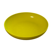 A simple, round, yellow pasta bowl with smooth sides is shown empty against a plain white background. The glossy finish and slight highlight on the rim indicate its shiny surface. This cast aluminum piece is also dishwasher safe for easy cleaning.
