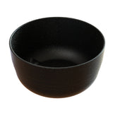 A plain, round, black Duracoat coated cast aluminum bowl with a matte, slightly speckled surface. The smooth, handleless Fruit Bowl is empty and photographed against a white background. It’s also dishwasher safe for easy cleaning.