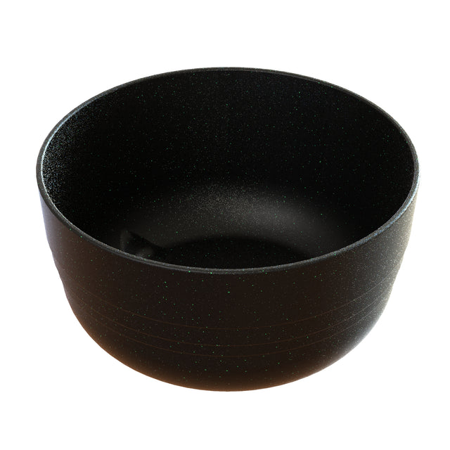 A plain, round, black Duracoat coated cast aluminum bowl with a matte, slightly speckled surface. The smooth, handleless Fruit Bowl is empty and photographed against a white background. It’s also dishwasher safe for easy cleaning.