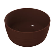 A simple, round, dark brown fruit bowl made of smooth cast aluminum, shown empty against a plain white background. The bowl has a slightly glossy finish with a subtle reflection inside and faint horizontal lines near the base.