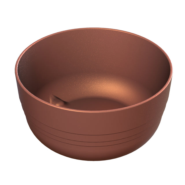 A round, metallic copper bowl with a matte copper finish sits on a white background. Crafted from cast aluminum, the bowl features horizontal grooves near the base and a smooth inner indentation, reflecting soft light and highlighting its texture.