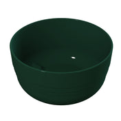 A dark green, round, plastic fruit bowl with smooth sides and a glossy finish is shown on a plain white background. The bowl is empty and viewed from a slightly elevated angle, highlighting its depth and curved interior.