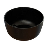 A round, deep, black cast aluminum fruit bowl with a smooth surface and small white speckles resembling a starry night sky. The bowl is empty and photographed against a white background.