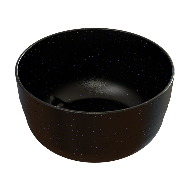 A round, deep, black cast aluminum fruit bowl with a smooth surface and small white speckles resembling a starry night sky. The bowl is empty and photographed against a white background.