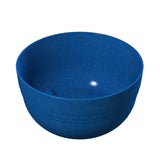 A plain, deep blue fruit bowl with a smooth matte finish and subtle horizontal ridges on the outside. The cast aluminum construction helps with cold holding, while light reflects slightly off the inner surface against a white background.