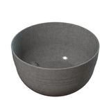 A grey cast aluminum bowl with a light reflecting off of it, ideal for use as a stylish fruit bowl or for cold holding foods.