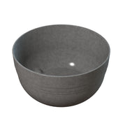 A grey cast aluminum bowl with a light reflecting off of it, ideal for use as a stylish fruit bowl or for cold holding foods.