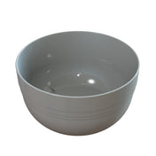 A shiny, empty, light gray ceramic fruit bowl with a smooth surface and subtle horizontal lines on the outside, photographed against a white background. The bowl has gently curved sides and reflective highlights inside and out.