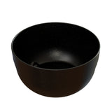 A black, round cast aluminum bowl with a smooth surface and subtle white speckles on the inside and outside, resembling a starry night sky. This modern, minimalist fruit bowl is empty and perfect for cold holding.