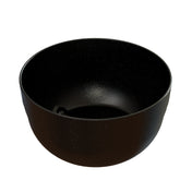 A black, round cast aluminum bowl with a smooth surface and subtle white speckles on the inside and outside, resembling a starry night sky. This modern, minimalist fruit bowl is empty and perfect for cold holding.