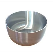 A shiny, metallic cast aluminum bowl with a smooth, reflective surface and faint horizontal lines near the base sits empty on a white background. The interior has a unique, curved indentation and a glossy finish. Perfect as an elegant fruit bowl.