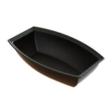 A black, nonstick cast aluminum rectangular loaf pan with high, slightly curved sides and a speckled interior, shown empty and angled to display depth and shape. The pan has a smooth, glossy finish and no visible handles.