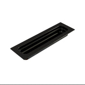 A black rectangular cast aluminum food pan with a hole in the middle.