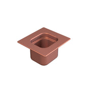 A square, copper-colored cast aluminum container with rounded edges and a wide flat rim, viewed angled from above on a white background. The container’s interior is hollow, and its outer surface is smooth and reflective.