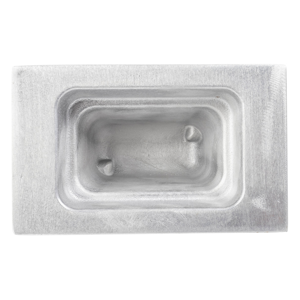 A rectangular, metallic food pan with smooth, rounded inner edges and two raised bumps inside. The brushed cast aluminum surface is shiny, featuring a recessed central cavity and a flat, thick border. Image captured from a top-down angle.