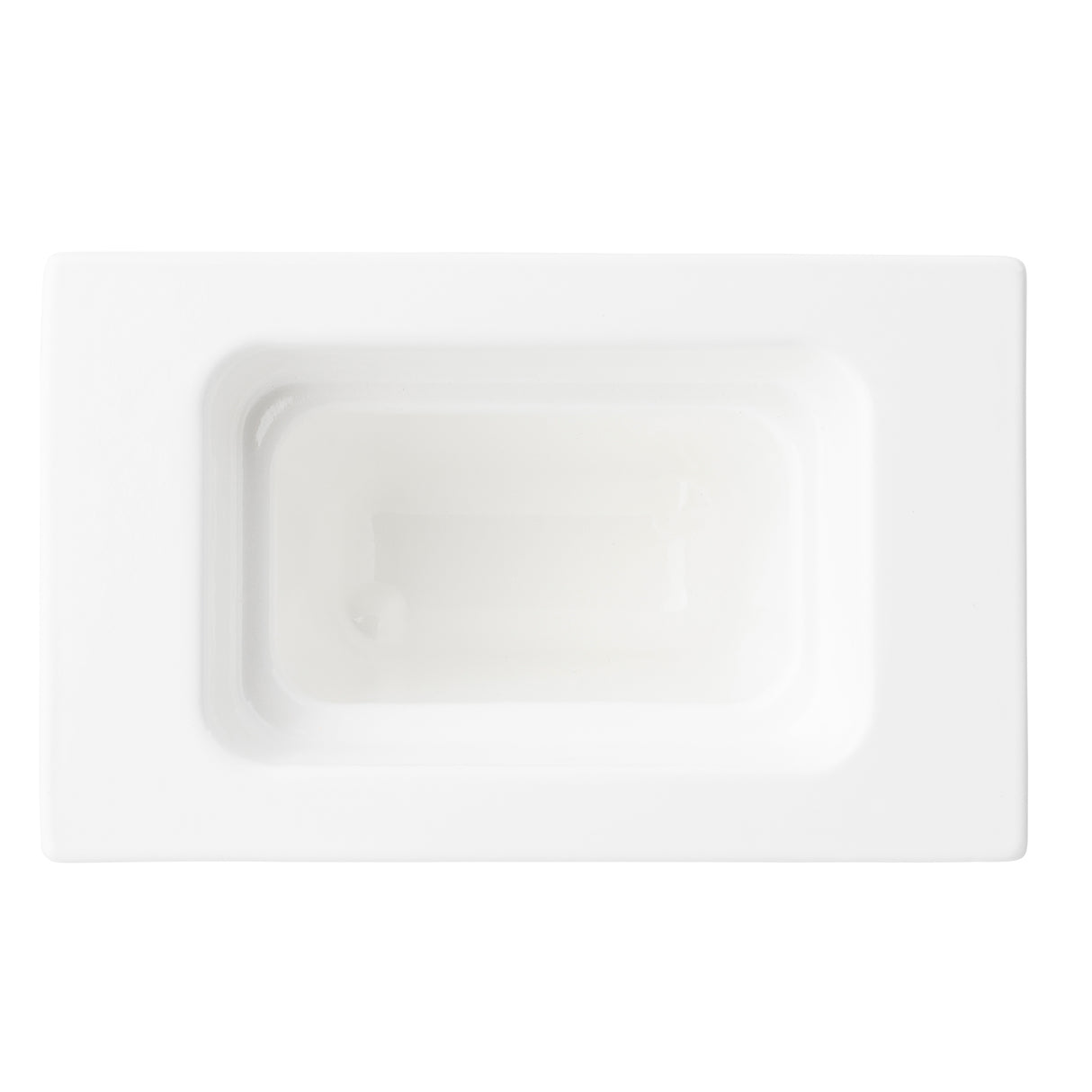 Rectangular white ceramic soap dish photographed from above, featuring a recessed center reminiscent of a food pan. The edges are clean and smooth, giving it a minimalist, modern appearance. Lighting highlights the glossy ceramic finish.