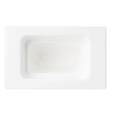 Rectangular white ceramic soap dish photographed from above, featuring a recessed center reminiscent of a food pan. The edges are clean and smooth, giving it a minimalist, modern appearance. Lighting highlights the glossy ceramic finish.