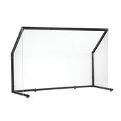 A transparent acrylic TableCraft sneeze guard with black metal frame and angled sides, designed for countertops or desks as a collapsible safety shield in public spaces. The plain white background highlights its clean and modern design.