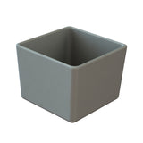 A simple, empty, gray square bowl with smooth surfaces and rounded corners, set against a white background. The open-top container appears to be made of cast aluminum or ceramic material.