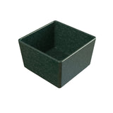 A small, square, deep green cast aluminum bowl with slightly rounded corners and a smooth, matte finish. The bowl has straight sides, a flat base, and a subtle marbled texture. Dishwasher safe, it sits empty against a white background.