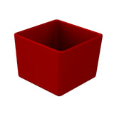 A 3D-rendered, empty, square-shaped cast aluminum bowl with smooth edges, colored solid red. The bowl is viewed at an angle, showing both the inside and two outer sides. The background is plain white.