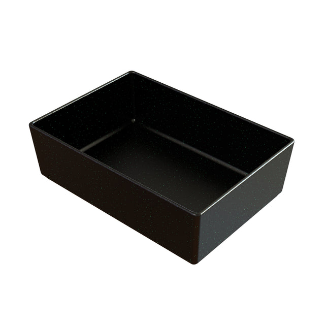 A rectangular, deep black cast aluminum baking pan with slightly angled sides and a smooth, matte finish. The pan’s surface features subtle white speckles, giving it a lightly textured appearance. It sits on a plain white background.