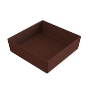 A plain, empty, square baking pan with high sides, shown at an angle. The brown pan, possibly cast aluminum or coated metal, features a smooth finish and sits against a white background.