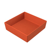 A square, deep, orange cast aluminum bowl with smooth sides and no handles, shown on a plain white background. Its simple, minimalist design makes it suitable for storage or serving.
