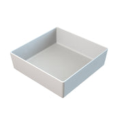 A plain, white, square-shaped ceramic dish with straight sides and a smooth surface. Ideal for cold holding, the empty dish is positioned on a white background, viewed from an angle above and to the side.
