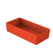 A rectangular, deep, open-top cold holding bowl made of solid orange Duracoat coated cast aluminum, shown at an angle on a white background. Smooth surfaces and slightly rounded edges give it a modern and minimalist appearance.
