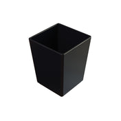 A black, rectangular, open-top cast aluminum bowl or wastebasket with smooth sides is placed against a white background. The container appears empty and is viewed from a slightly elevated angle, showing its interior.