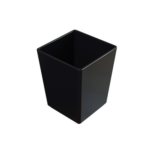 A black, rectangular, open-top cast aluminum bowl or wastebasket with smooth sides is placed against a white background. The container appears empty and is viewed from a slightly elevated angle, showing its interior.