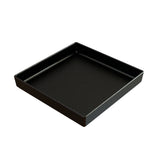 A square, shallow black tray with slightly raised edges and a smooth surface. Crafted from cast aluminum, this modern piece features a subtle speckled pattern and is set empty against a plain white background.