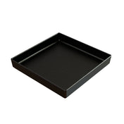 A square, shallow black tray with slightly raised edges and a smooth surface. Crafted from cast aluminum, this modern piece features a subtle speckled pattern and is set empty against a plain white background.