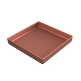 A metallic, square-shaped baking pan with tall sides, shown from an angle. The pan features a smooth, copper finish bowl look and clean, straight edges. Its interior is empty and evenly colored with a slightly glossy finish.