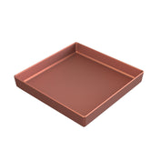 A metallic, square-shaped baking pan with tall sides, shown from an angle. The pan features a smooth, copper finish bowl look and clean, straight edges. Its interior is empty and evenly colored with a slightly glossy finish.