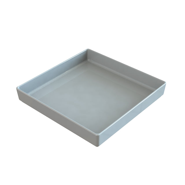 A plain, white, square tray with raised edges crafted from Duracoat coated cast aluminum. The glossy tray is empty and shown at an angle that highlights both the top and two side edges against a white background.