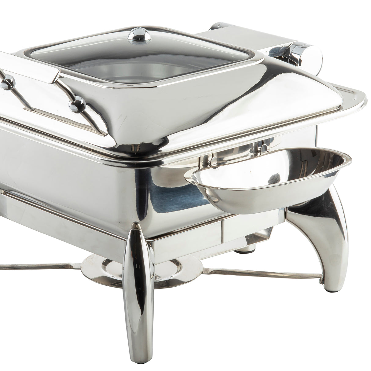 A shiny, stainless steel TableCraft chafing dish with a dome lid, rectangular food pan, and curved legs. A small, dishwasher safe side tray serves as a replacement spoon rest, attached to the front. The overall design is modern and reflective.