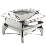A shiny 6 quart stainless steel chafer with a hinged lid, sturdy curved legs, and a side attachment for utensils or condiments. This fuel chafer dish keeps food warm for serving at buffets or events.