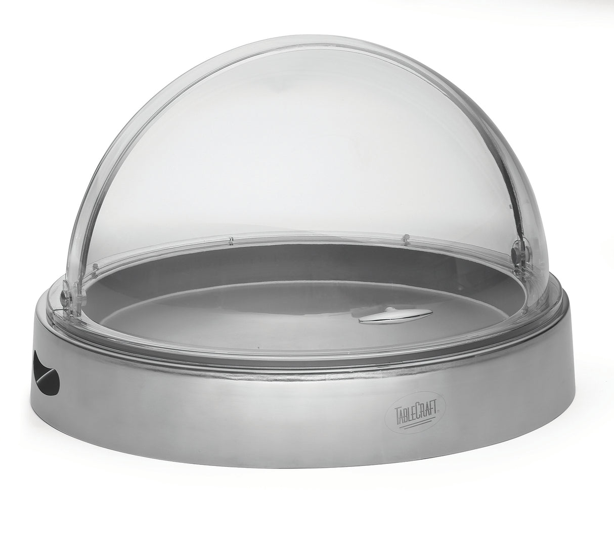 A round cold server with a stainless steel base and a clear polycarbonate dome lid. The tray features a small handle on top for easy lifting, a side cutout, and the TableCraft brand visible on the front.